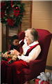 Mrs. Santa with a baby boy. 