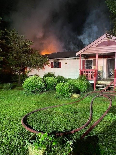 House with fire coming out of the top